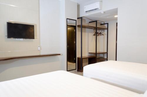 Imagen de la habitación del Hotel Arcadia Manado. Foto 16