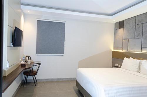Imagen de la habitación del Hotel Arcadia Manado. Foto 17