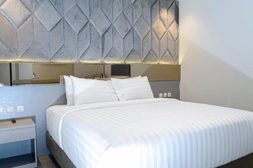 Imagen de la habitación del Hotel Arcadia Manado. Foto 19