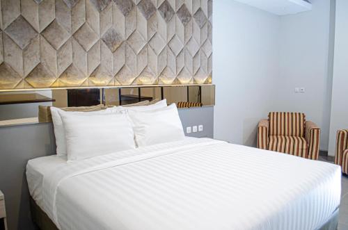 Imagen de la habitación del Hotel Arcadia Manado. Foto 20