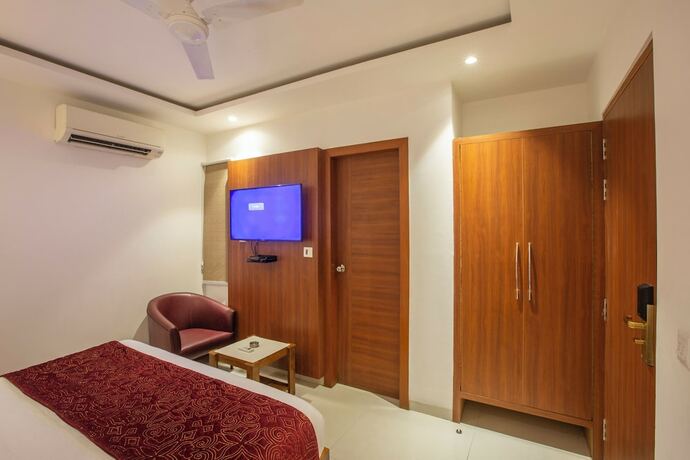 Imagen de la habitación del Hotel Arch Suites. Foto 17