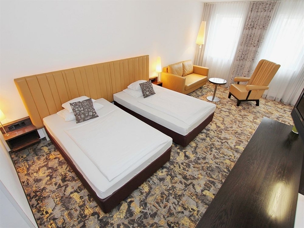 Imagen de la habitación del Hotel Arcotel Camino. Foto 10