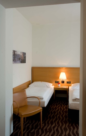 Imagen de la habitación del Hotel Arcotel Castellani Salzburg. Foto 9