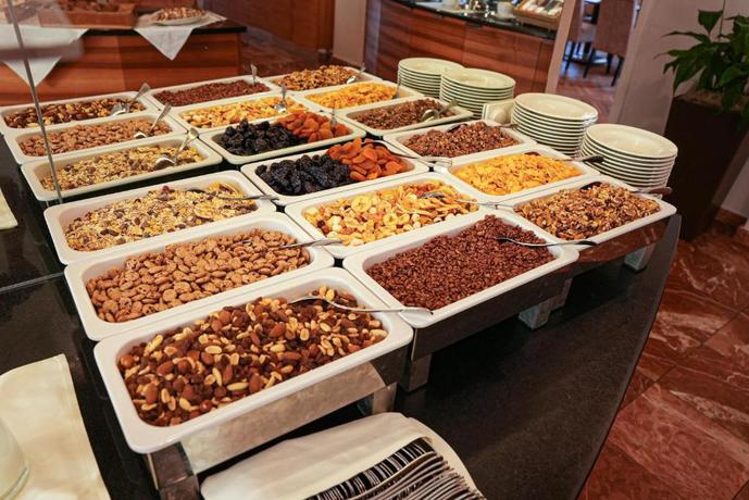 Imagen del bar/restaurante del Hotel Arcotel Castellani Salzburg. Foto 3