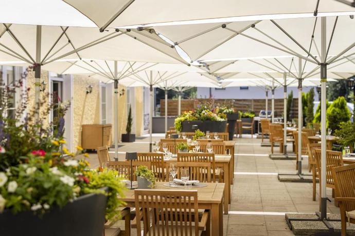 Imagen del bar/restaurante del Hotel Arcotel Castellani Salzburg. Foto 6