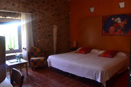 Imagen de la habitación del Hotel Arcs De Monells. Foto 3