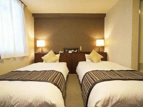 Imagen de la habitación del Hotel Areaone Miyazaki City. Foto 3