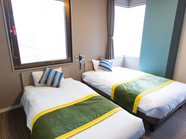 Imagen de la habitación del Hotel Areaone Nobeoka. Foto 11
