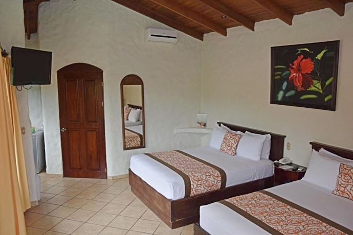 Imagen de la habitación del Hotel Arenal Volcano Inn. Foto 11