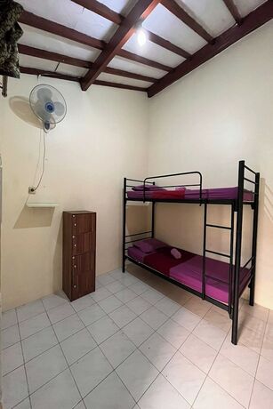Imagen de la habitación del Hotel Arjuna 31 Homestay - Hostel. Foto 14