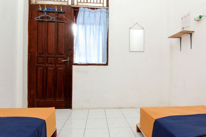 Imagen de la habitación del Hotel Arjuna 31 Homestay - Hostel. Foto 24