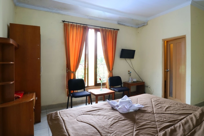 Imagen de la habitación del Hotel Arjuna, Bogor. Foto 16