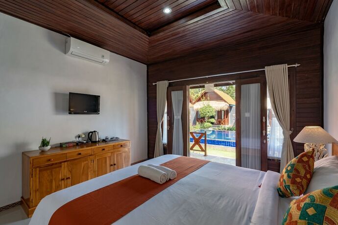Imagen de la habitación del Hotel Arjuna Bungalow. Foto 32