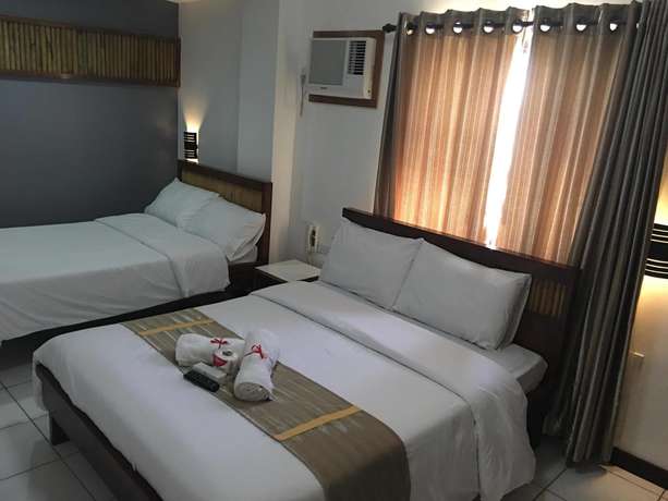 Imagen de la habitación del Hotel Ark Bayz Suites. Foto 11