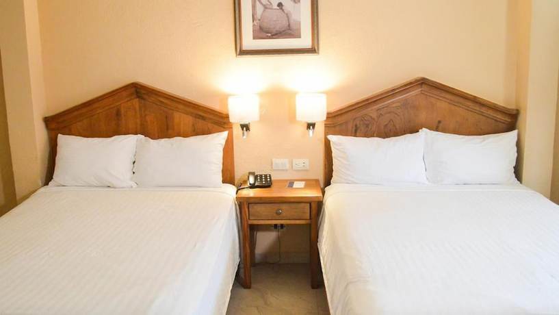 Imagen de la habitación del Hotel Armida Express. Foto 6