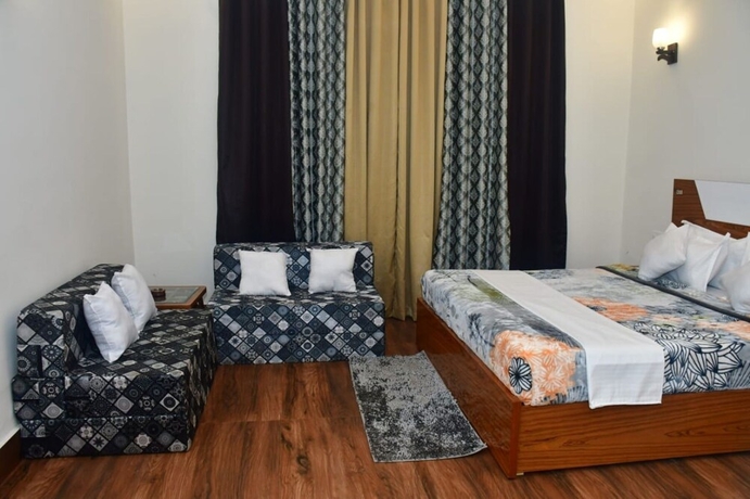 Imagen de la habitación del Hotel Aroma Green Resort. Foto 8