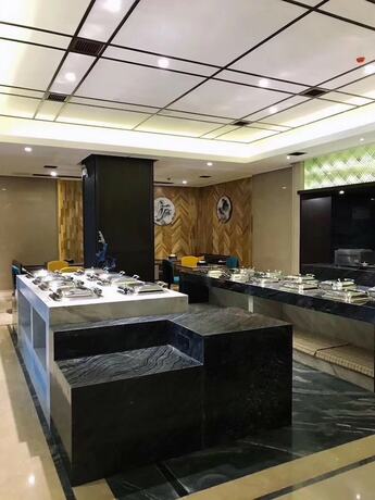 Imagen del bar/restaurante del Hotel Aroma Hotel. Foto 7