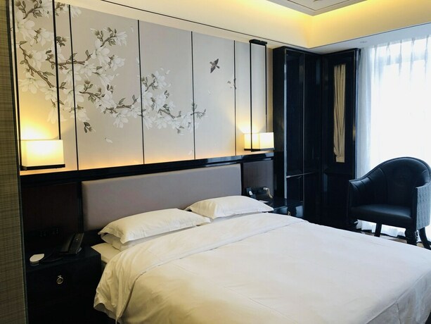 Imagen de la habitación del Hotel Aroma Hotel. Foto 10