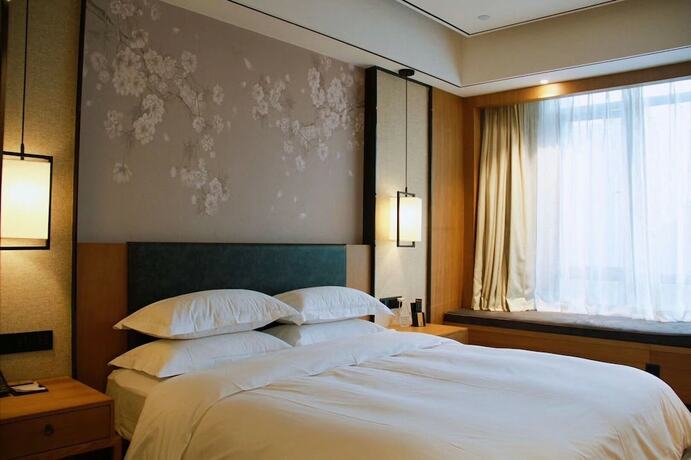 Imagen de la habitación del Hotel Aroma Hotel. Foto 12