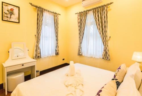 Imagen de la habitación del Hotel Aroma Rice Boutique. Foto 10