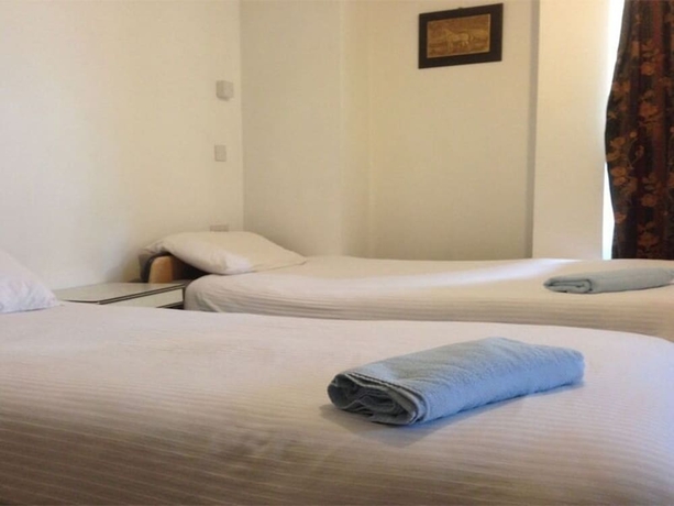 Imagen de la habitación del Hotel Aron Guest House. Foto 4