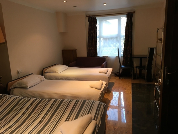 Imagen de la habitación del Hotel Aron Guest House. Foto 12