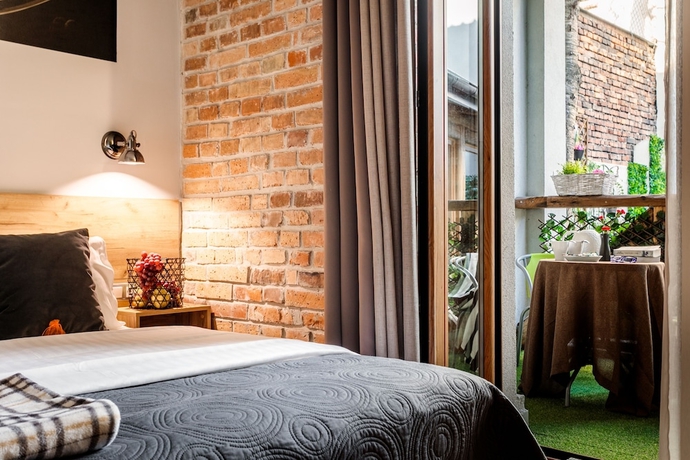 Imagen de la habitación del Hotel Art And Garden Residence. Foto 11