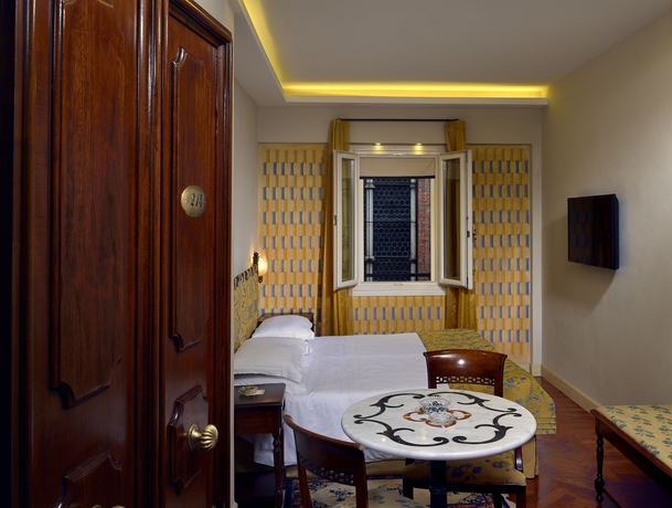 Imagen de la habitación del Hotel Art Commercianti. Foto 10