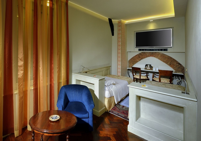 Imagen de la habitación del Hotel Art Commercianti. Foto 12