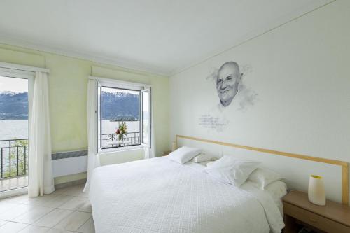 Imagen de la habitación del Hotel Art Ristorante Posta Al Lago. Foto 6