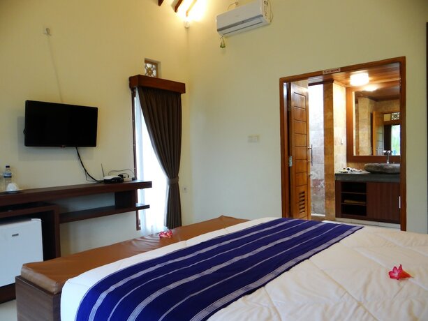Imagen de la habitación del Hotel Artati Lombok Bungalows and Restaurant. Foto 19