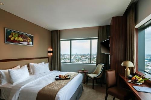 Imagen de la habitación del Hotel Arthama Hotels Losari Makassar. Foto 6