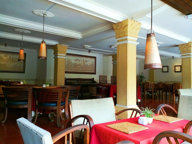 Imagen del bar/restaurante del Hotel Artini 2 Cottages. Foto 4