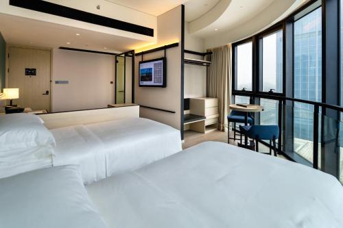 Imagen de la habitación del Hotel Artyzen Habitat Hengqin Zhuhai. Foto 12