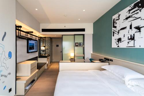 Imagen de la habitación del Hotel Artyzen Habitat Hengqin Zhuhai. Foto 13