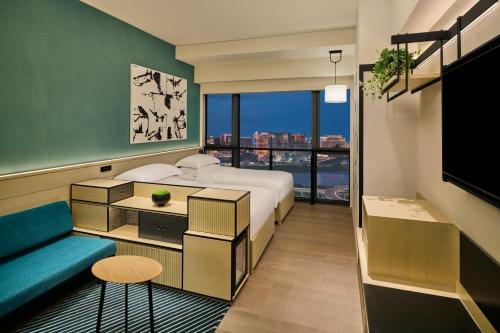 Imagen de la habitación del Hotel Artyzen Habitat Hengqin Zhuhai. Foto 19
