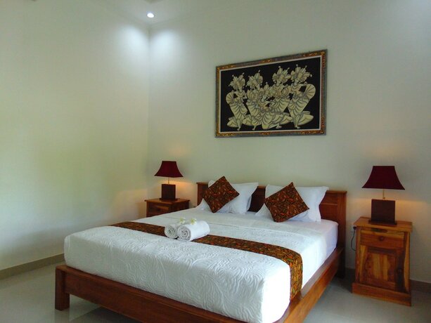Imagen de la habitación del Hotel Arumanis Homestay. Foto 17