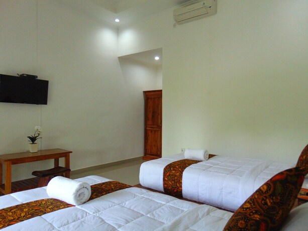 Imagen de la habitación del Hotel Arumanis Homestay. Foto 18