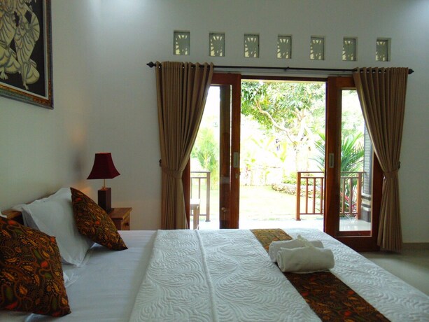 Imagen de la habitación del Hotel Arumanis Homestay. Foto 23