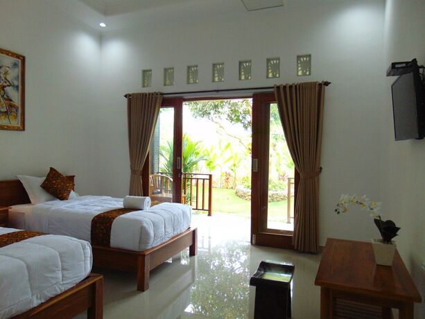 Imagen de la habitación del Hotel Arumanis Homestay. Foto 27