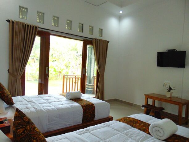 Imagen de la habitación del Hotel Arumanis Homestay. Foto 28