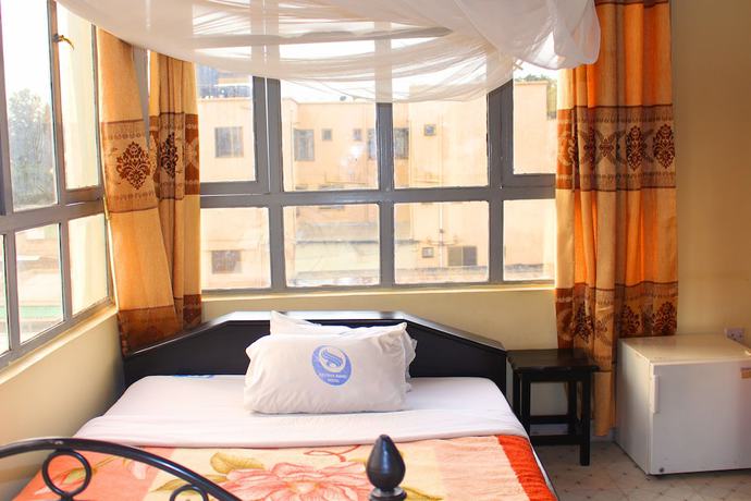 Imagen de la habitación del Hotel Arusha Bimel. Foto 7