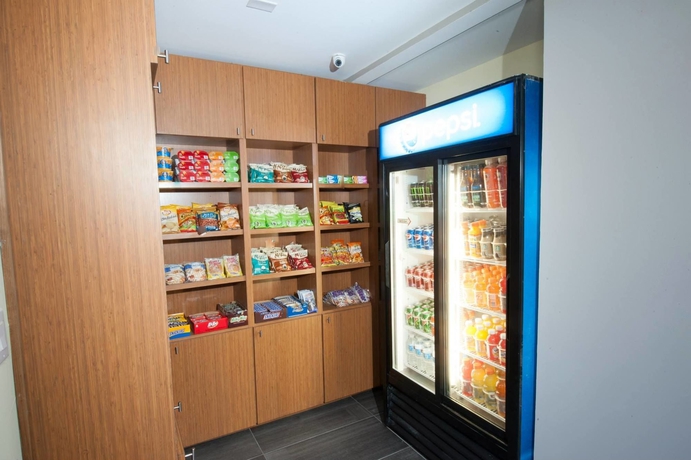 Imagen del bar/restaurante del Hotel Arya Inn and Suites Farmers Branch. Foto 7
