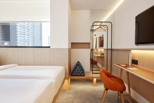 Imagen de la habitación del Hotel Asai Bangkok Sathorn. Foto 13