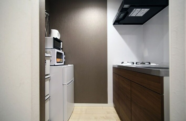 Imagen de la habitación del Hotel Asakusa Koma House. Foto 18