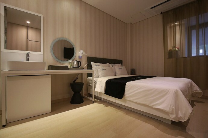 Imagen de la habitación del Hotel Asan Cube. Foto 23