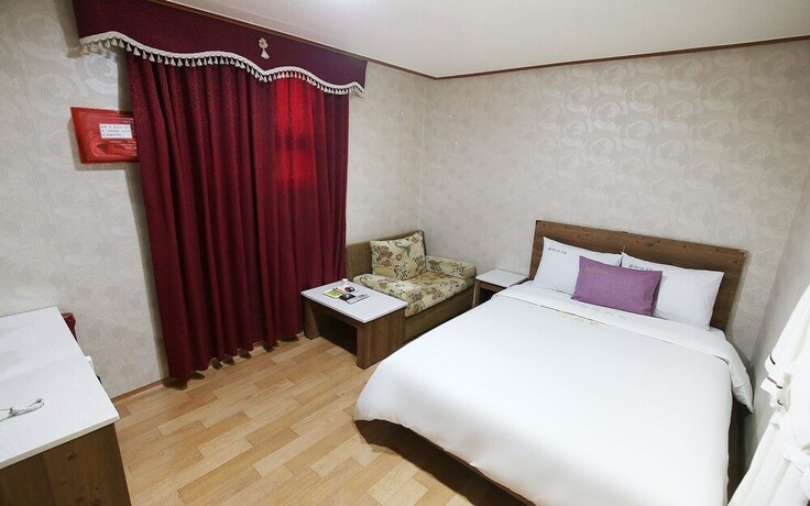 Imagen de la habitación del Hotel Asan Western. Foto 25