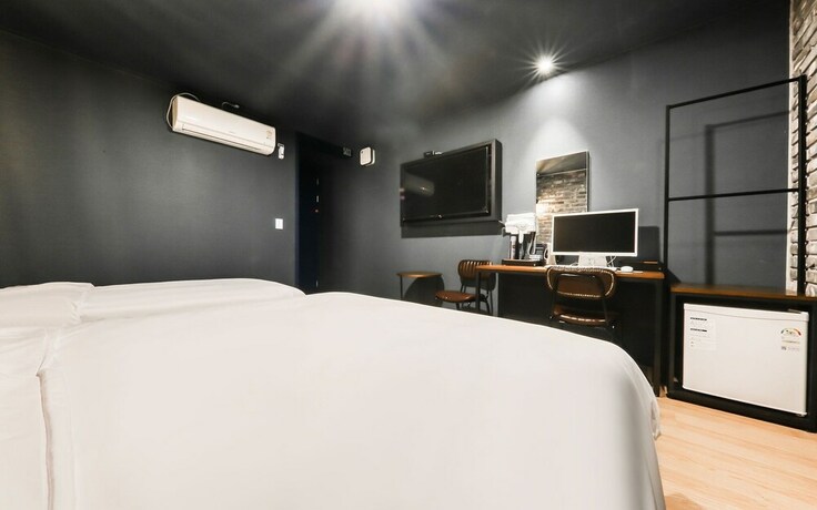 Imagen de la habitación del Hotel Asan Wol. Foto 23