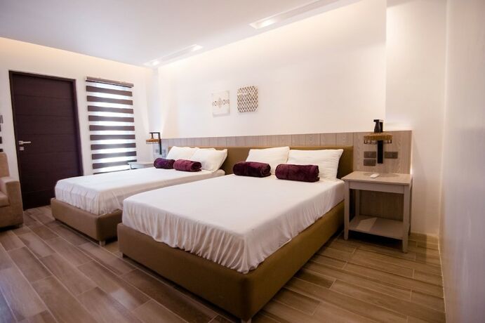 Imagen de la habitación del Hotel Asaricha Tropical Beach Resort. Foto 14
