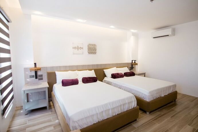 Imagen de la habitación del Hotel Asaricha Tropical Beach Resort. Foto 17